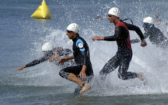 050625-N-7575W-011
Point Mugu, Calif. (June 25, 2005) - Sylvain Dodet, front left, from France, and Bas Borreman, right, from the Netherlands, along with other tri-athletes, dash into the sea to begin their 1.5 kilometer swim during the 12th annual World Military Triathlon. The triathlon held at Naval Base Ventura County, consisted of a 1.5 kilometer swim, 40 kilometer bike ride and a 10 kilometer run, was held June 25, at Naval Base Ventura County. U.S. Navy photo by PhotographerÕs Mate 2nd Class Jason R. William (RELEASED)